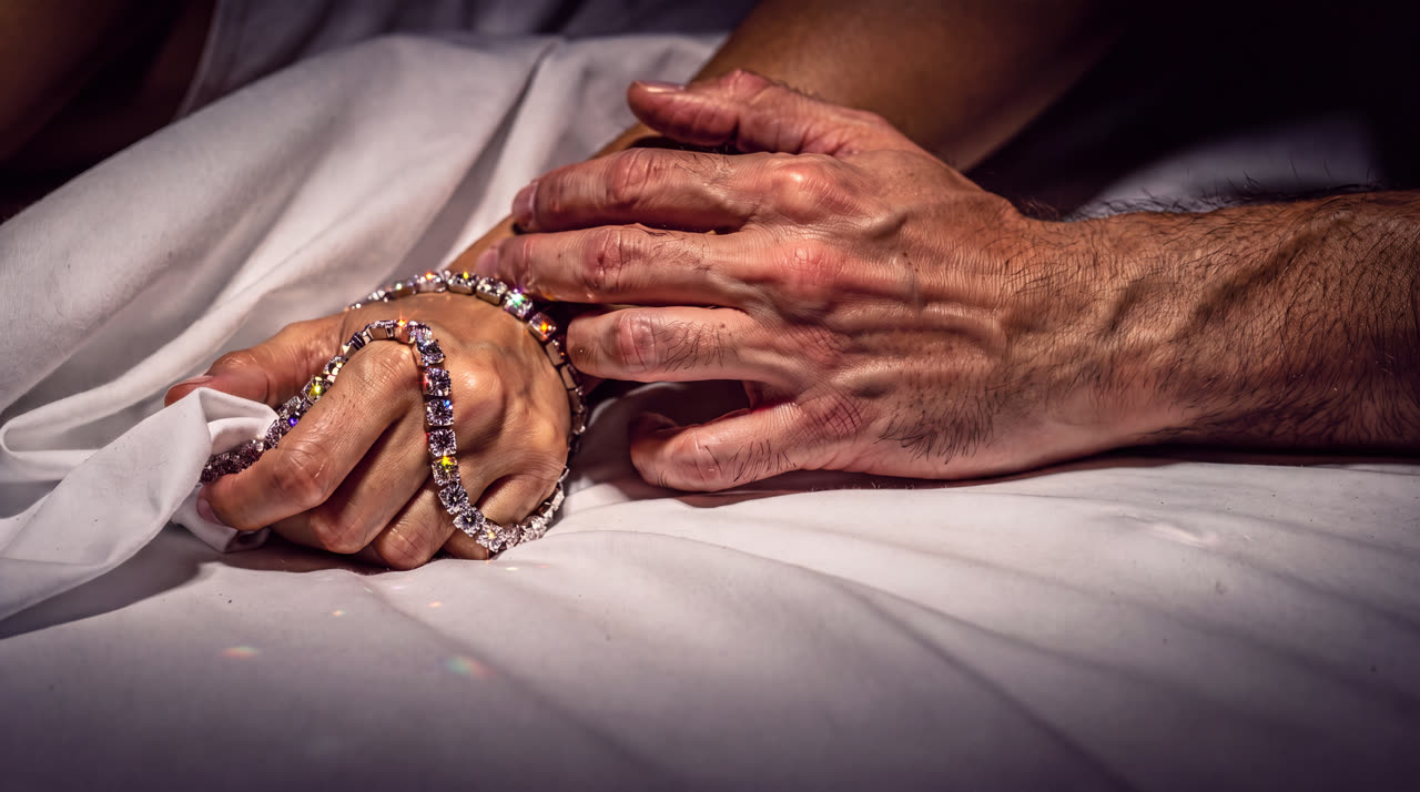 Her fist in the sheets tangled with a diamond rivière, his hand over her wrist, a dive watch past midnight